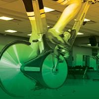 Close up of feet riding an exercise bike