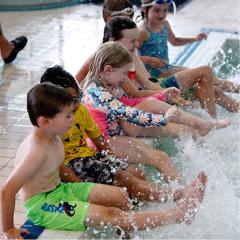 kids splashing in pool