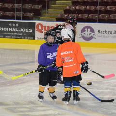 Kids learning hockey
